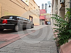 Limousine in a back alley