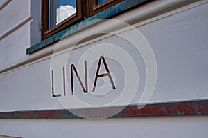 LINA lettering on a house wall photo
