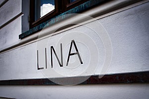 LINA lettering on a house wall photo
