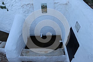 Part of the whitewashed old fountain in Linares de la Sierra, Huelva, Spain photo