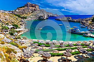 Lindos city on Rhodes island, Greece. St Paul\'s Bay Beach and the Acropolis, on Rhodos Island, Greece at Aegean Sea