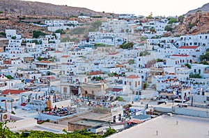 Lindos, Greece - August 11, 2018: Landscape of the white houses of the city of Lindos at sunset, Greece