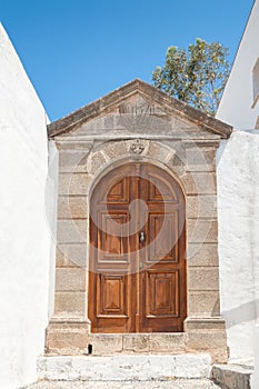 Lindos, Greece. 05/29/2018. Traditional door to household in Lindos Town. Greek Island of Rhodes. Europe