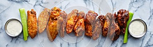 Line of buffalo wings with different flavors