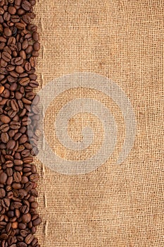 Line of coffee beans and burlap