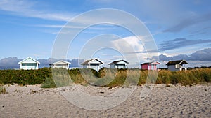 Line of colorful boathouses on the Skanor beach, Sweden