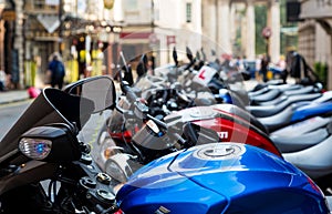 Line of Colorful Mopeds on London Street
