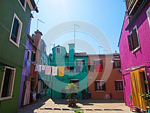 Line of Colourful Washing Between Coloured Houses of Burano, Venice, Italy photo