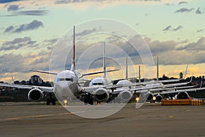 Line of commercial airliners on runway