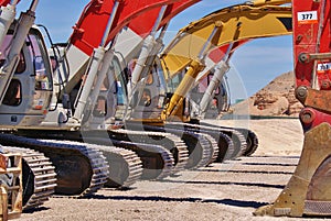 Line of earth movers