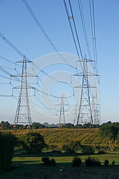 Line of Electricity Pylons across countryside