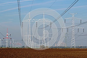 Line of electricity pylons and nuclear power plant