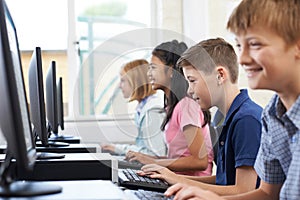 Line Of Elementary Pupils In Computer Class