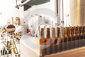Line with empty brown beer bottles