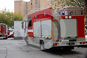 A line of fire engines. Fire in the room. Fire hazard. Failure to comply with fire safety regulations