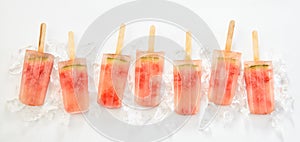 Line of frozen watermelon popsicles or lollies