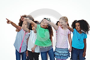 Line of girls standing with hands pointing up