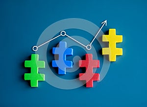 Line graph with arrow on multicolor jigsaw puzzle blocks as a business chart on blue background.