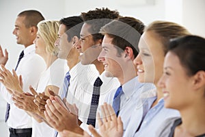 Line Of Happy And Positive Business People Applauding