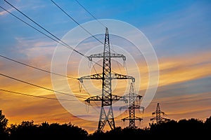 Line of high voltage wires during scenic sunset