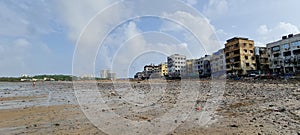 Line of houses on Versova beach in Mumbai on a cloudy rain day