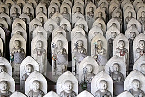 Line of hundreds of Buddha jizo statues at Reisenji Buddhist Temple