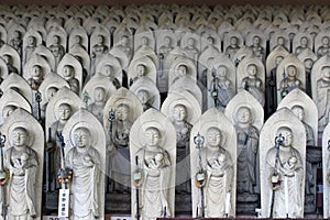 Line of hundreds of Buddha jizo statues at Reisenji Buddhist Temple