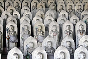 Line of hundreds of Buddha jizo statues at Reisenji Buddhist Temple