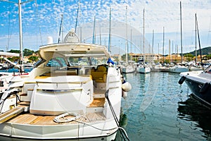 Line of landing yachts in calm port