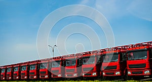 A line of large trucks photo