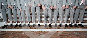 Line of men's legs and shoes