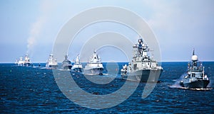 A line of modern russian military naval battleships warships in the row, northern fleet and baltic sea fleet in the open sea