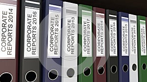 Line of multicolor office binders with Corporate reports tags different years 3D rendering