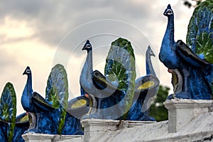 A line of peacock statues line the main courtyard at the Kataragama temple in southern Sri Lanka near Tissamaharama.