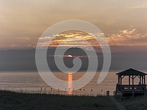 Line of Pelicans Over Ocean Sunrise on the Outer Banks of North Carolina