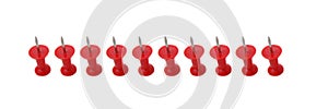 Line of red push pins