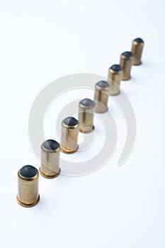 Line of rubber bullets and cartridges in a row