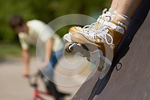 In-line skater in outdoor skatepark