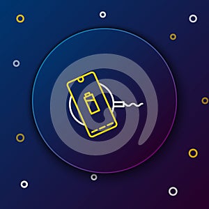 Line Smartphone charging on wireless charger icon isolated on blue background. Charging battery on charging pad