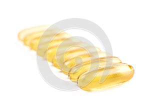 Line of softgel pills isolated