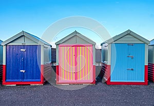 A line of three beach huts on Brighton promenade 2 beach huts ar