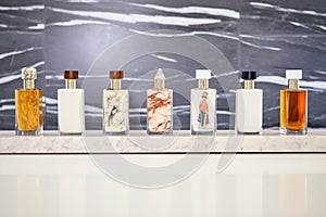 a line of unbranded jarred lotions on a granite slab