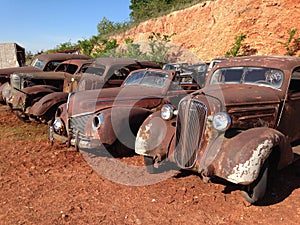 Line Up of Antique Automobiles photo