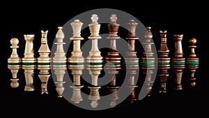 Line of wooden chess pieces isolated at dark background