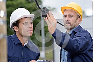 Lineman checking outdoor cable