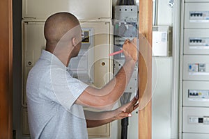 Lineman checking the panel