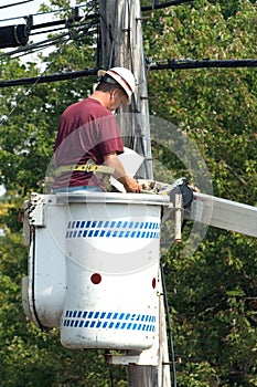 Lineman cheking wiring drawings