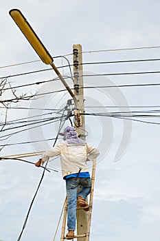 A lineman working on cable