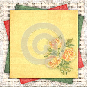 Linen background with a multi-coloured paper