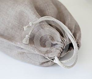 Linen bag close up with cotton string closure photo